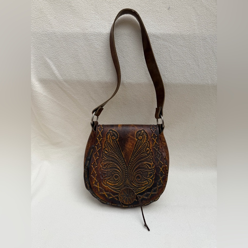 Vintage 70’s hand tooled hand screwed leather bag.